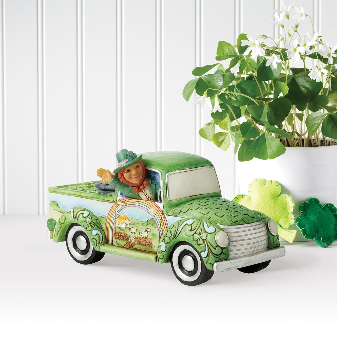 Jim Shore Heartwood Creek: Leprechaun in Green Truck Figurine sparkle-castle