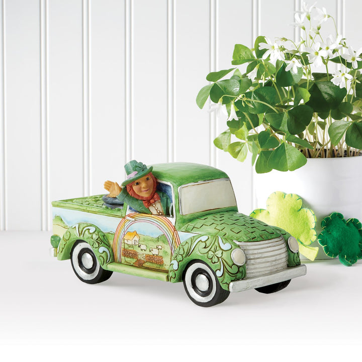 Jim Shore Heartwood Creek: Leprechaun in Green Truck Figurine sparkle-castle