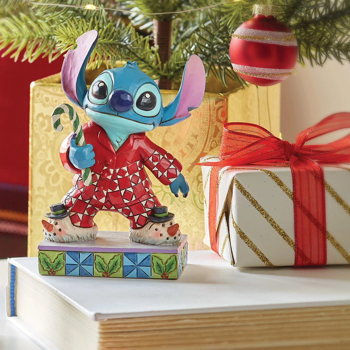 Jim Shore Disney Traditions: Stitch In Christmas PJ's Personality Pose Figurine sparkle-castle