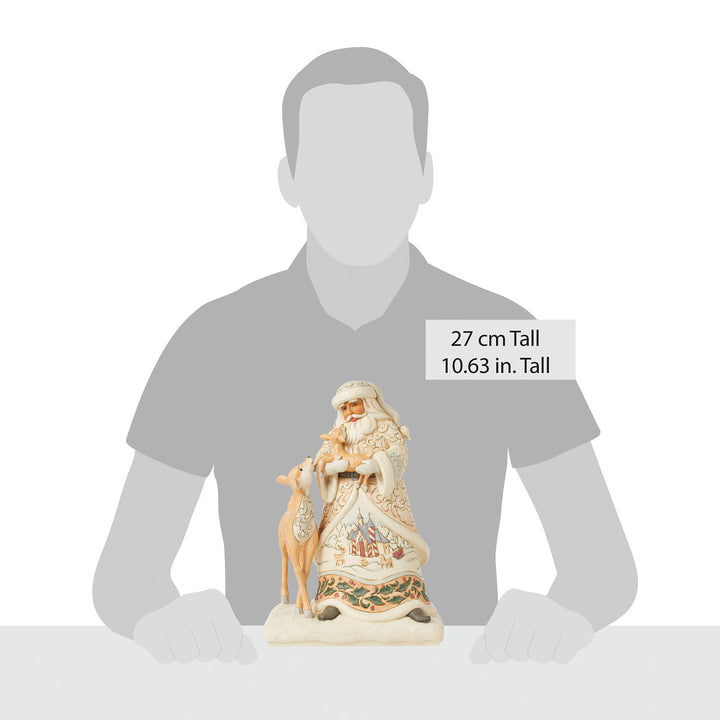 Jim Shore Heartwood Creek: White Woodland Santa Holding Fawn Figurine sparkle-castle