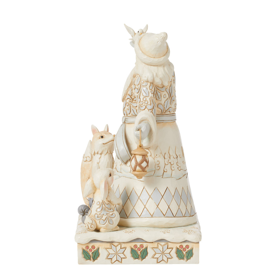 Jim Shore Heartwood Creek: White Woodland Santa Holding Dove and Lantern Figurine sparkle-castle