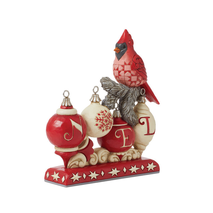 Jim Shore Heartwood Creek: Nordic Noel Cardinal on NOEL Sign Figurine sparkle-castle