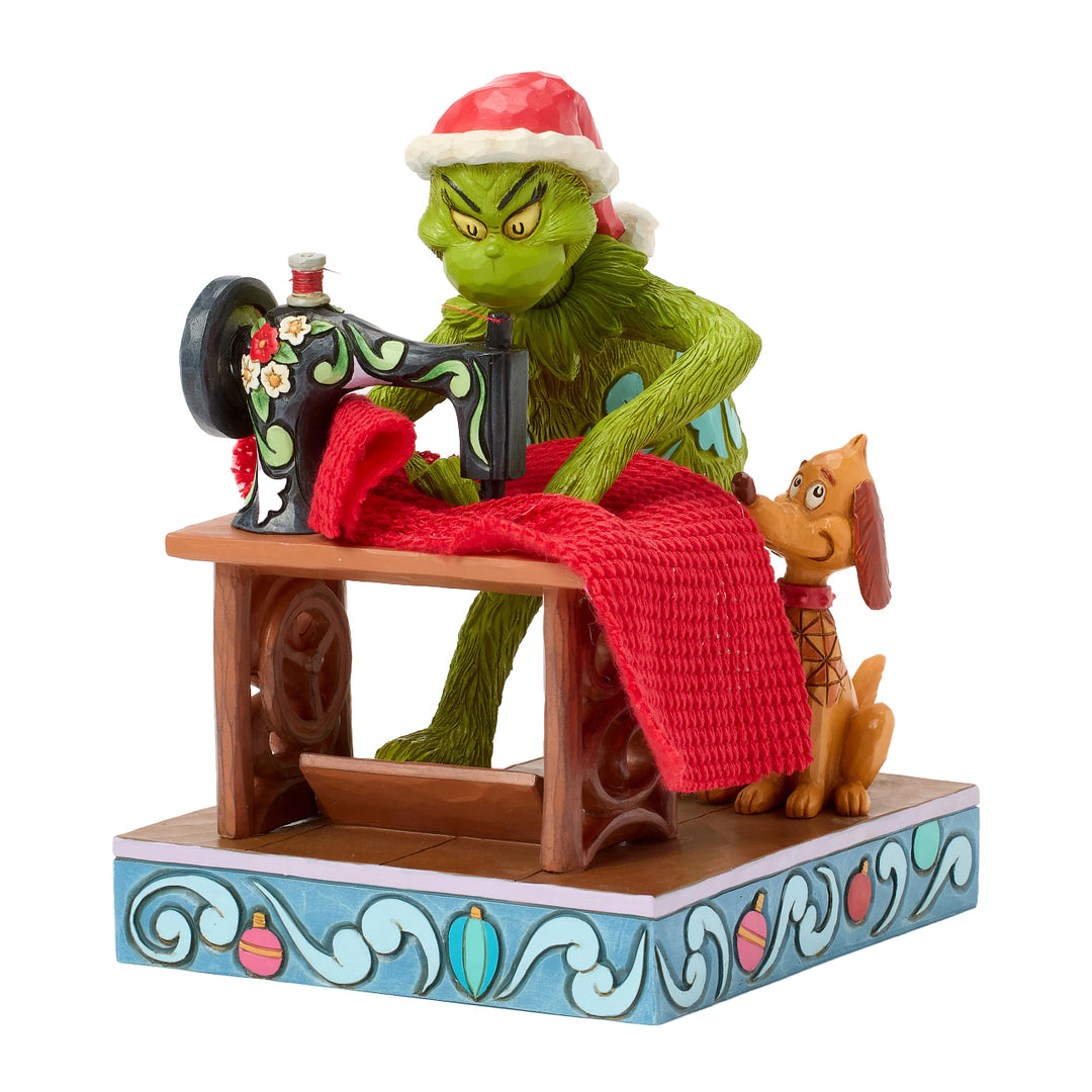 Jim Shore The Grinch: Grinch Sewing Santa Suit Figurine sparkle-castle