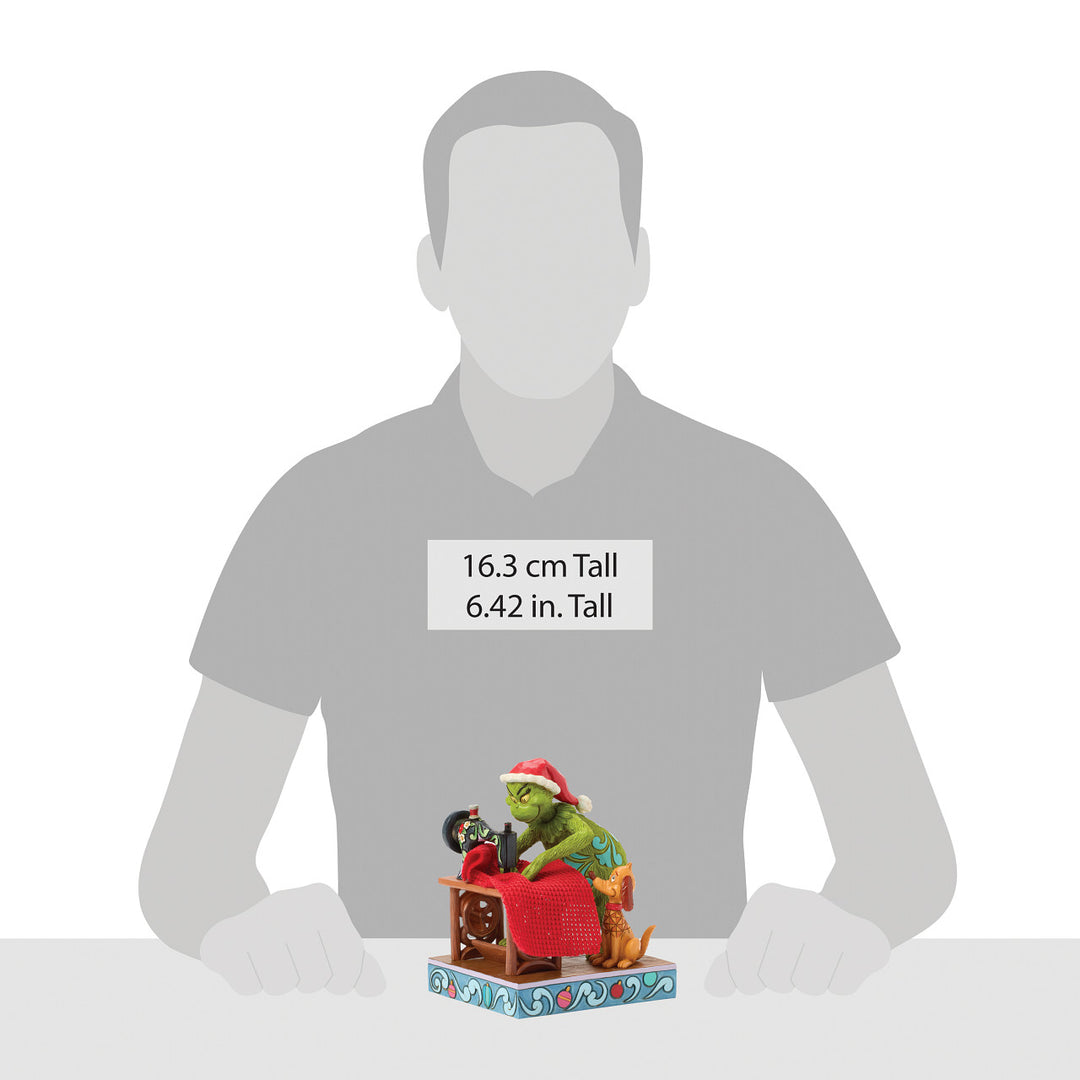 Jim Shore The Grinch: Grinch Sewing Santa Suit Figurine sparkle-castle