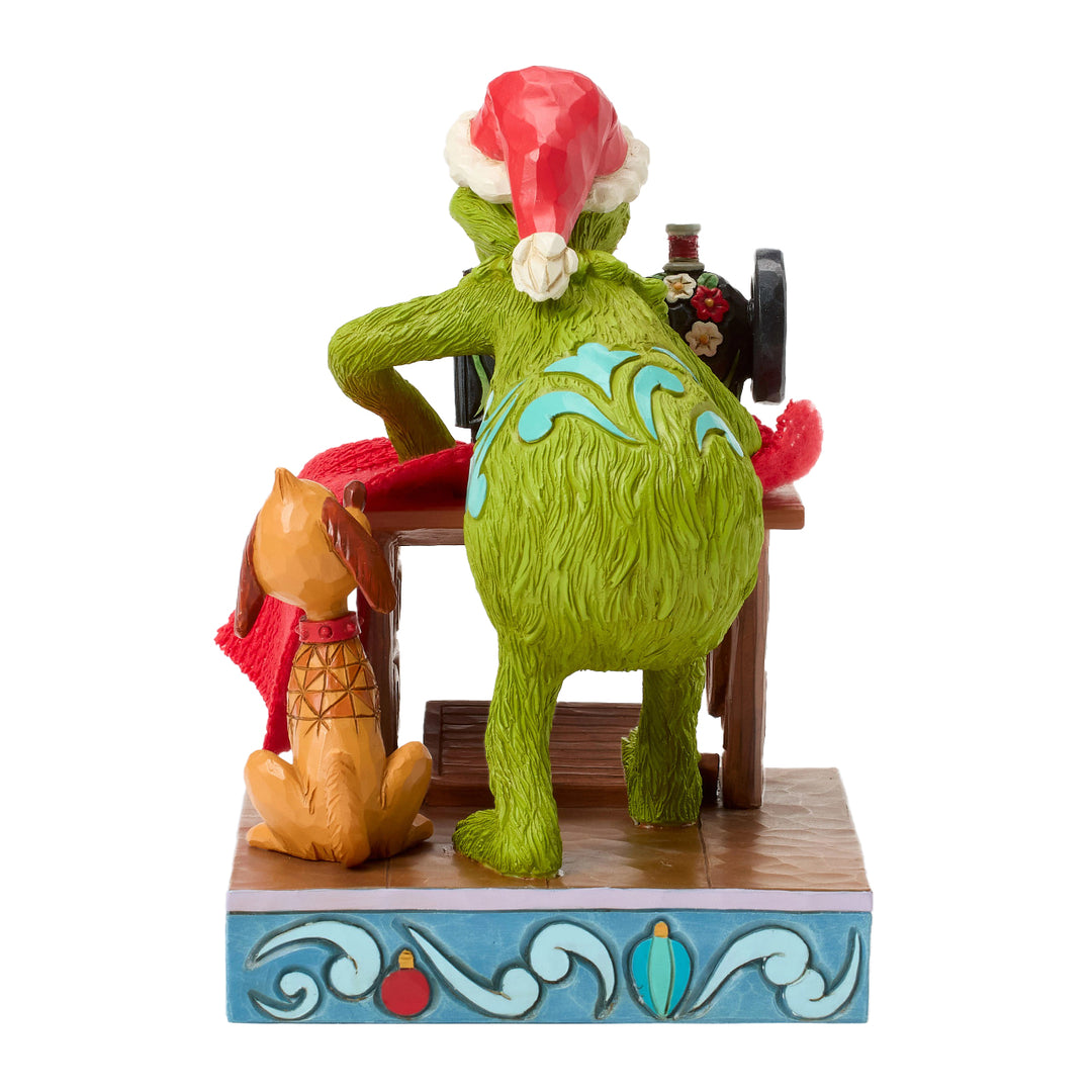 Jim Shore The Grinch: Grinch Sewing Santa Suit Figurine sparkle-castle