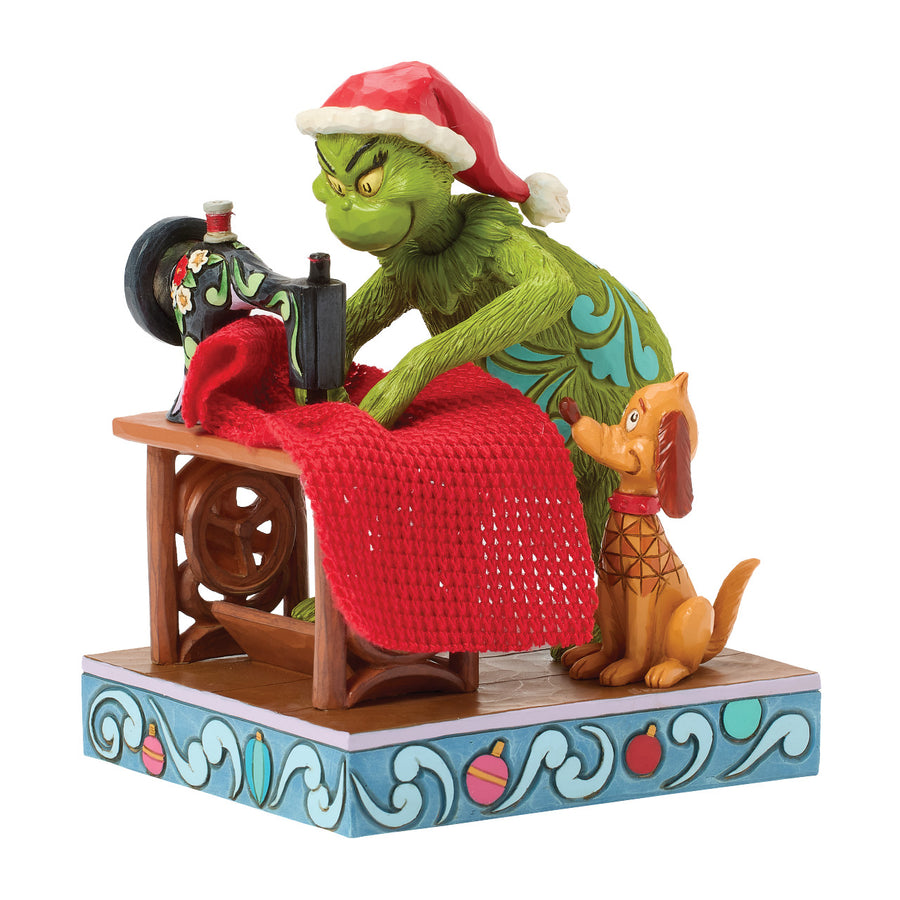 Jim Shore The Grinch: Grinch Sewing Santa Suit Figurine sparkle-castle