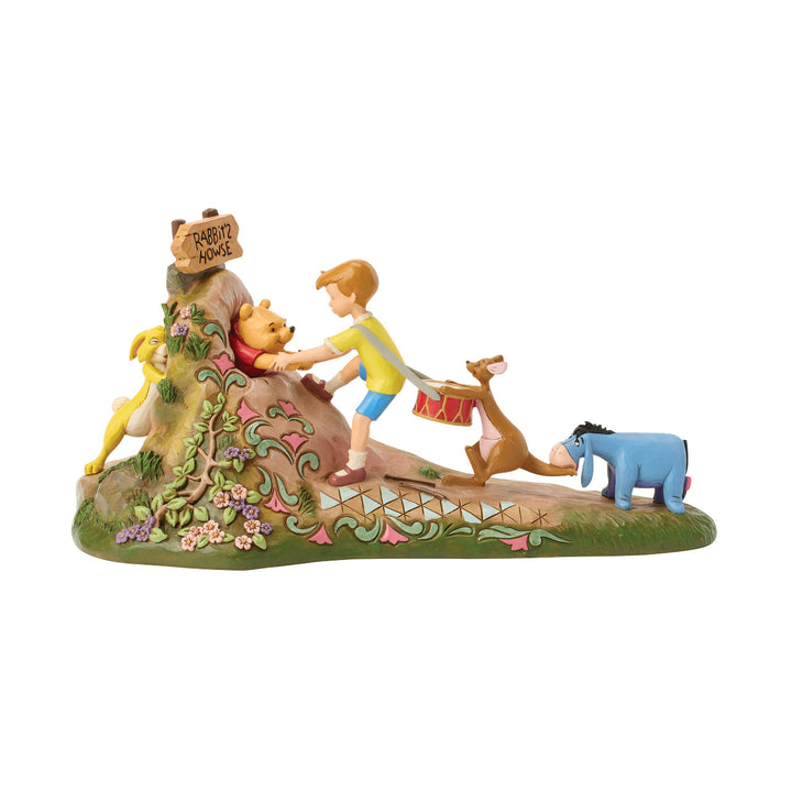 Jim Shore Disney Traditions: Pulling Pooh Out Of Rabbit's House Figurine sparkle-castle