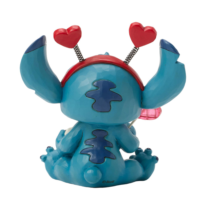 Jim Shore Disney Traditions: Stitch Wearing Hearts Headband Figurine sparkle-castle