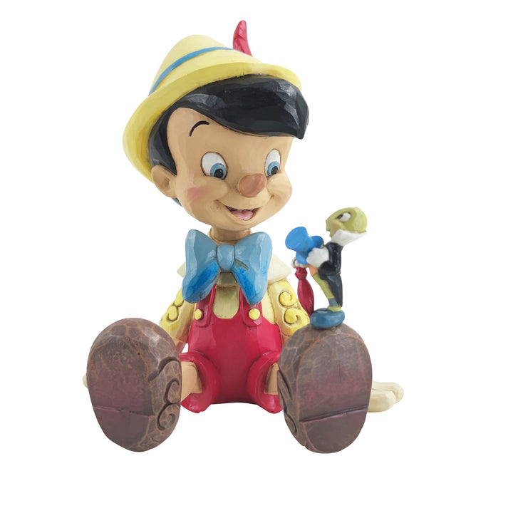 Jim Shore Disney Traditions: Pinocchio & Jiminy Sitting Figurine sparkle-castle