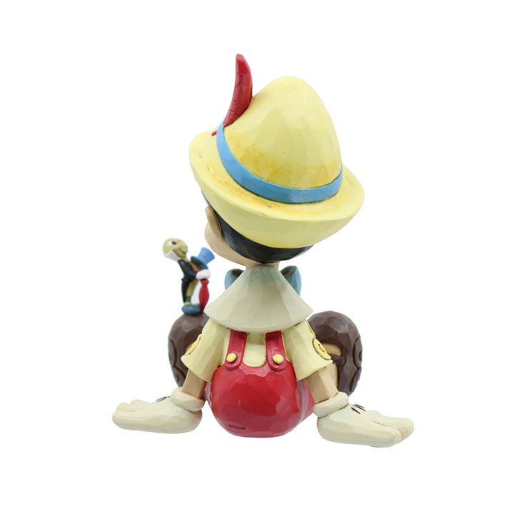 Jim Shore Disney Traditions: Pinocchio & Jiminy Sitting Figurine sparkle-castle