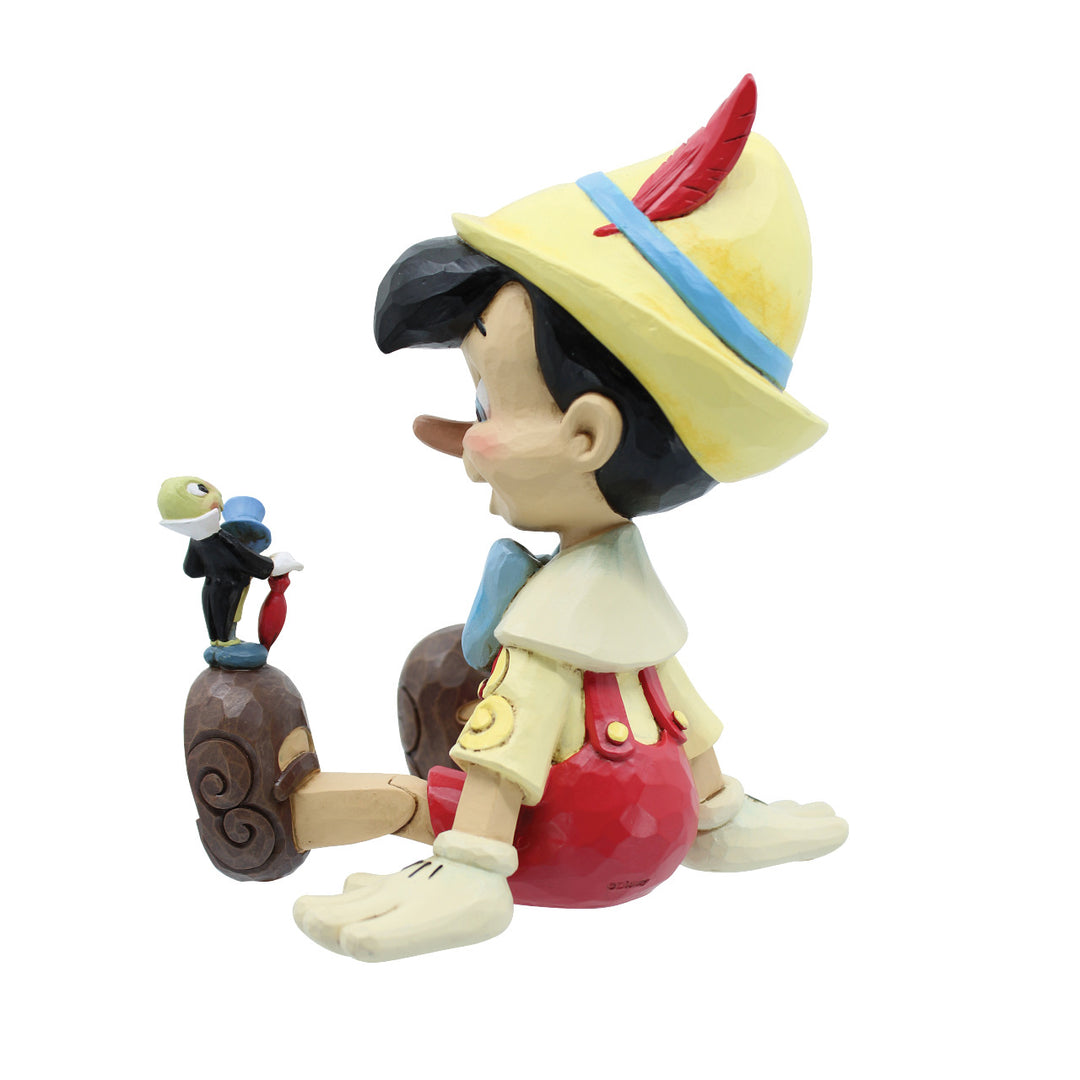 Jim Shore Disney Traditions: Pinocchio & Jiminy Sitting Figurine sparkle-castle
