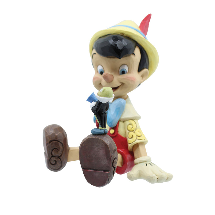 Jim Shore Disney Traditions: Pinocchio & Jiminy Sitting Figurine sparkle-castle