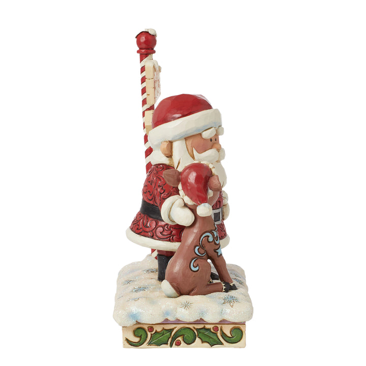 Jim Shore Rudolph Traditions: Rudolph and Santa Next to Sign Figurine sparkle-castle