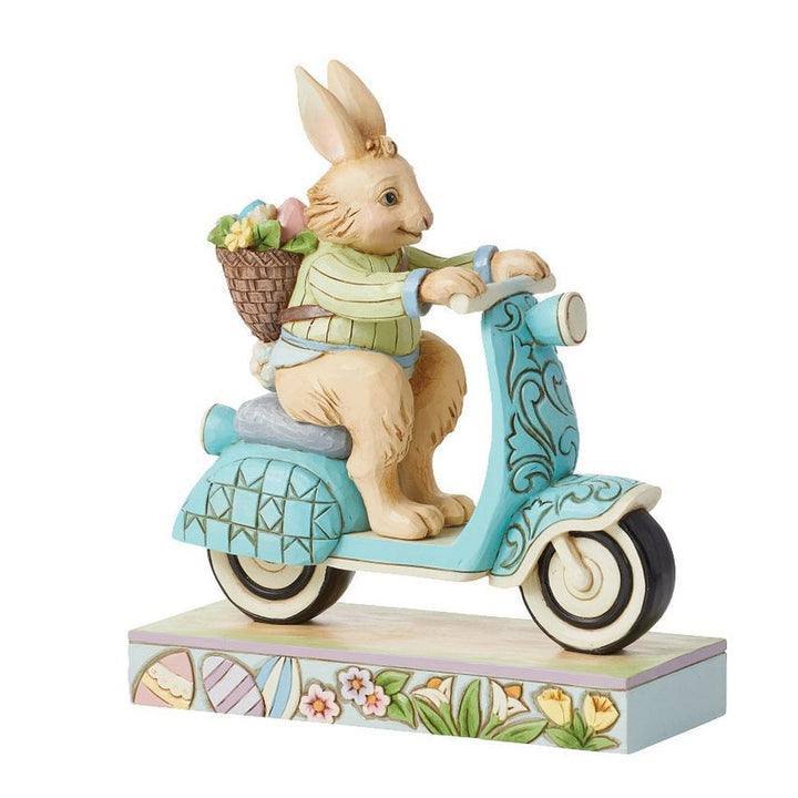 Jim Shore Heartwood Creek: Easter Bunny Riding Scooter Figurine sparkle-castle