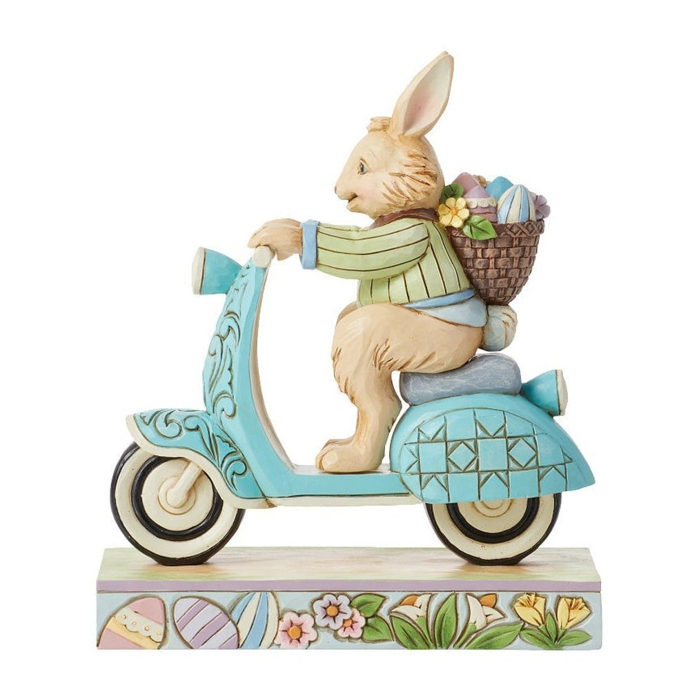 Jim Shore Heartwood Creek: Easter Bunny Riding Scooter Figurine sparkle-castle