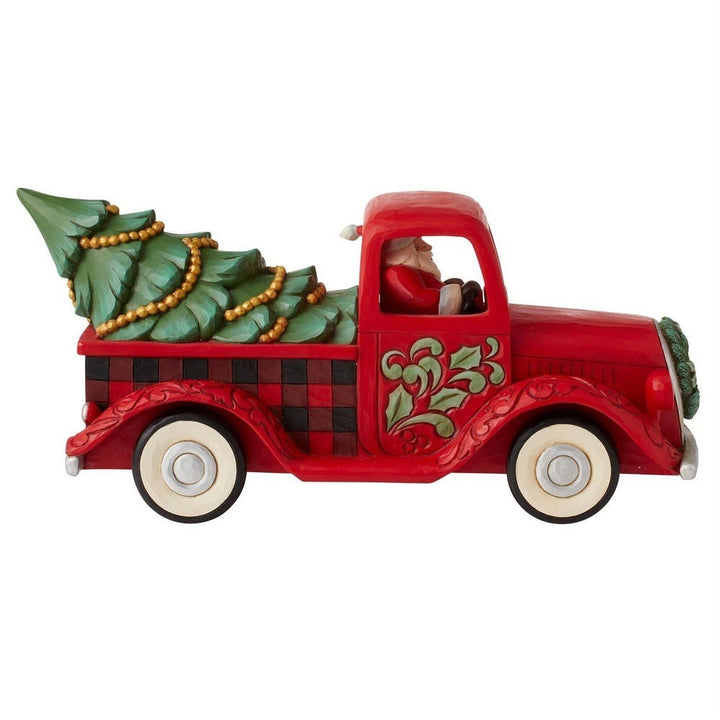 Jim Shore Heartwood Creek: Highland Glen Santa in Plaid Truck Figurine sparkle-castle