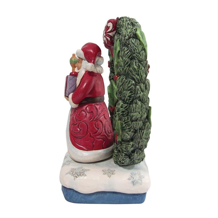 Jim Shore Heartwood Creek: Santa by Light Up Wreath Figurine sparkle-castle
