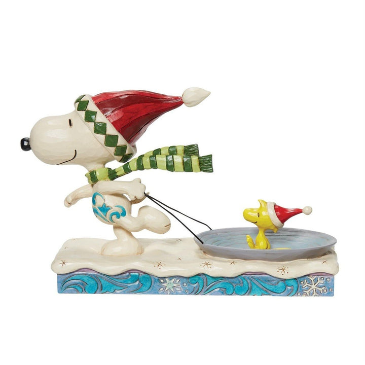 Jim Shore Peanuts: Snoopy Pulling Woodstock on Saucer Figurine sparkle-castle