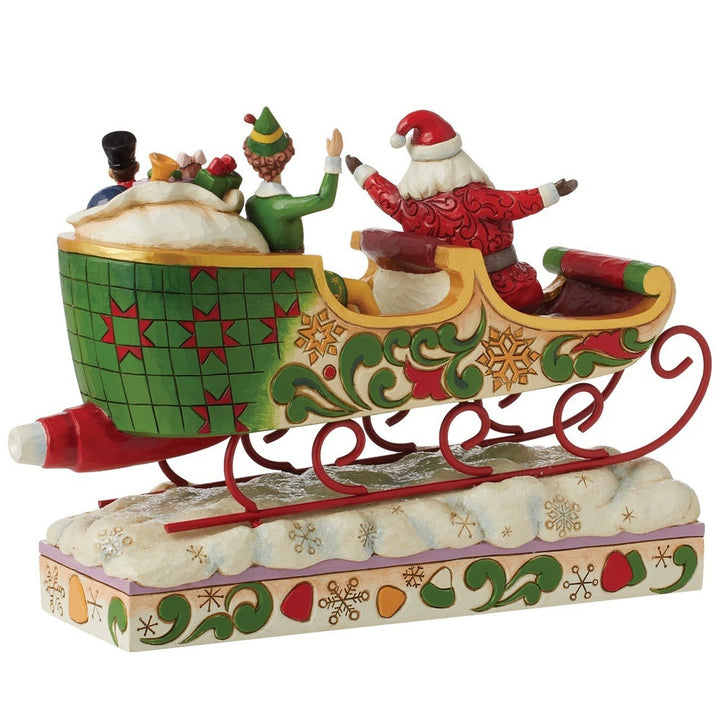 Jim Shore Elf: Buddy Elf with Santa in Sleigh Figurine sparkle-castle