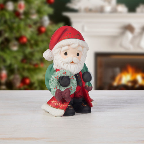 Precious Moments: Annual Christmas Santa With Wreath Figurine sparkle-castle