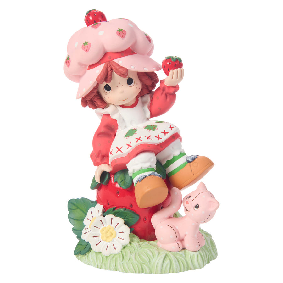 Precious Moments Strawberry Shortcake: Strawberry Shortcake Sitting on Strawberry Figurine sparkle-castle