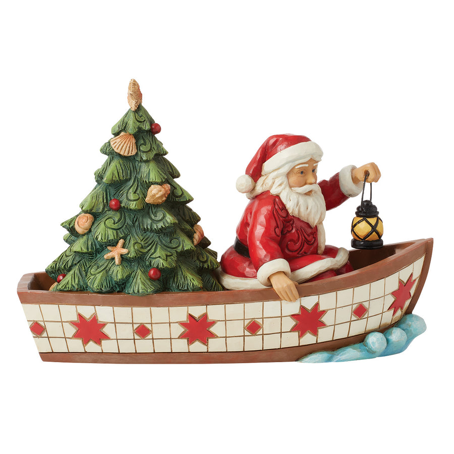 Jim Shore Heartwood Creek: Santa in Boat With Tree Figurine sparkle-castle