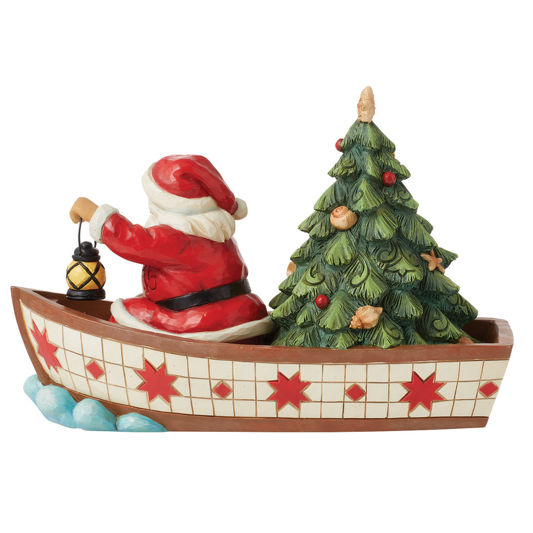 Jim Shore Heartwood Creek: Santa in Boat With Tree Figurine sparkle-castle