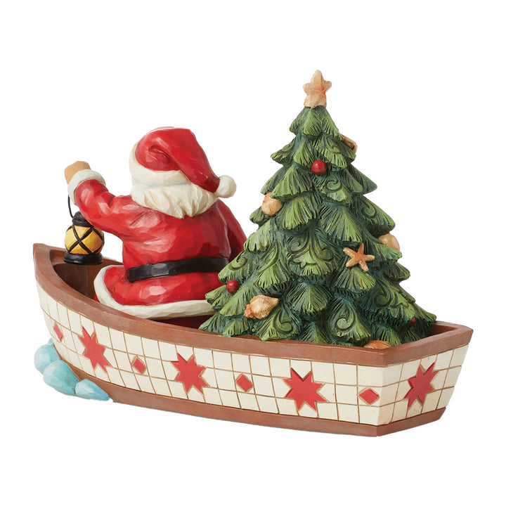 Jim Shore Heartwood Creek: Santa in Boat With Tree Figurine sparkle-castle