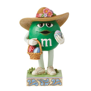 Jim Shore M&M'S: Green M&M With Easter Hat and Basket Figurine sparkle-castle