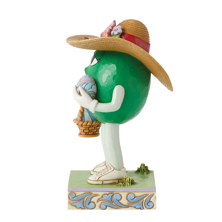 Jim Shore M&M'S: Green M&M With Easter Hat and Basket Figurine sparkle-castle