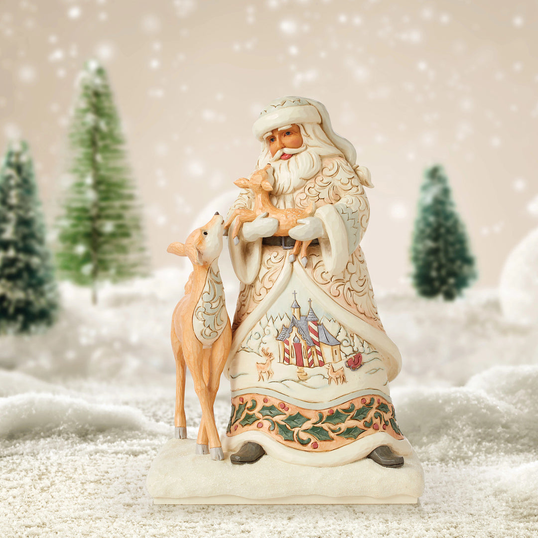 Jim Shore Heartwood Creek: White Woodland Santa Holding Fawn Figurine sparkle-castle