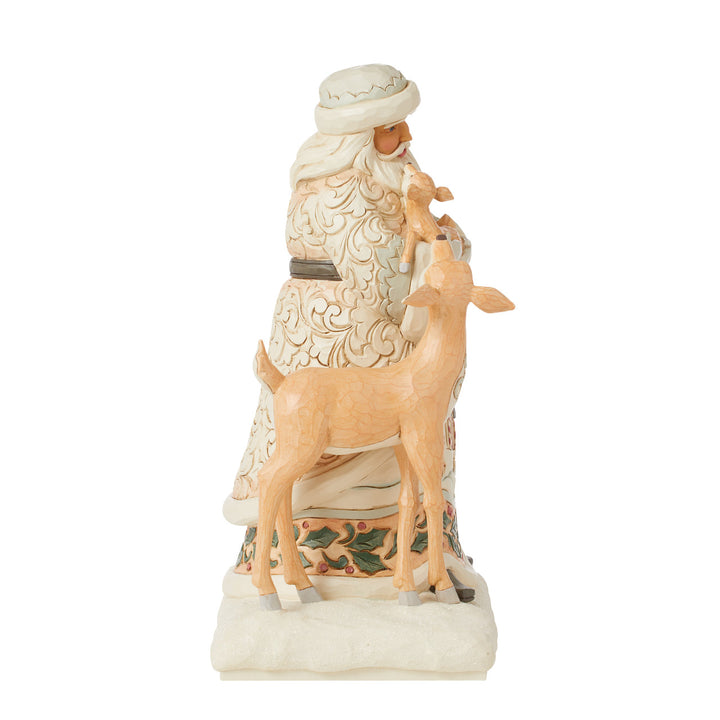 Jim Shore Heartwood Creek: White Woodland Santa Holding Fawn Figurine sparkle-castle