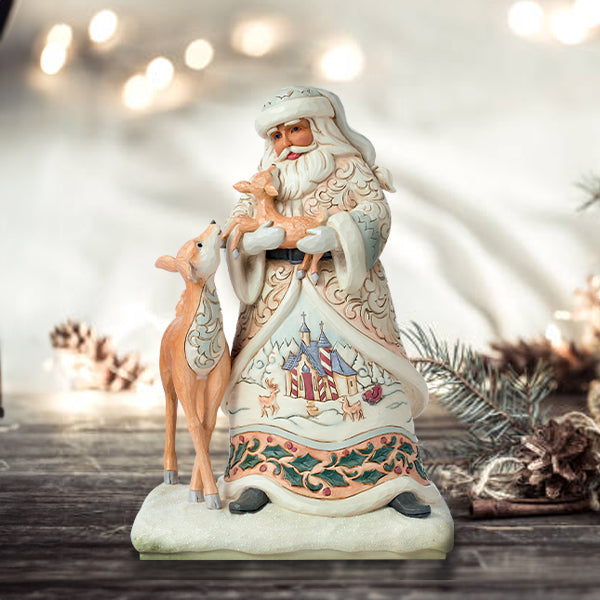 Jim Shore Heartwood Creek: White Woodland Santa Holding Fawn Figurine sparkle-castle