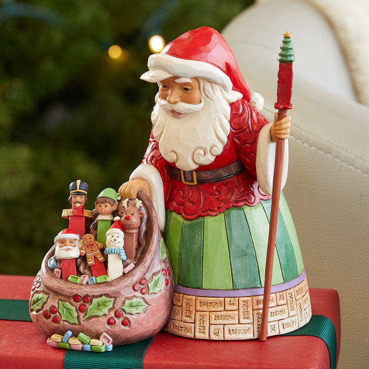 Jim Shore PEZ: Santa Holding Gift Bag Filled With PEZ Figurine sparkle-castle