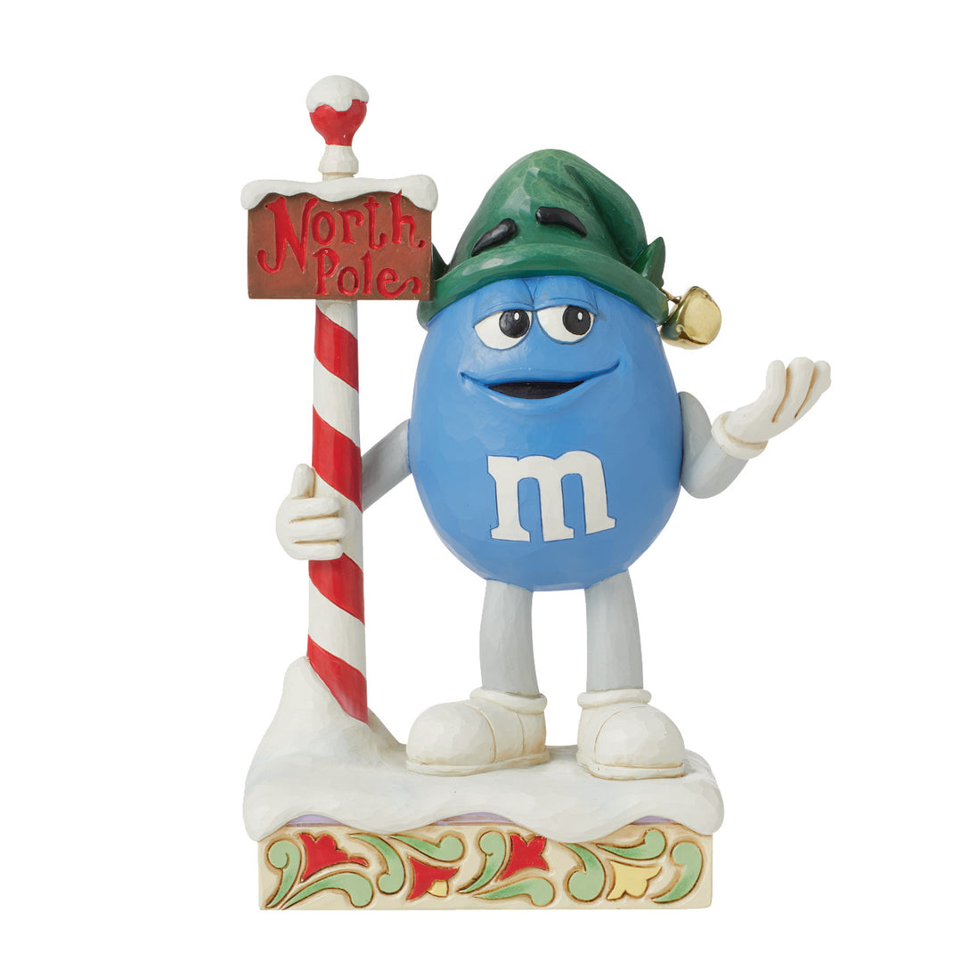 Jim Shore M&M'S: Blue M&M With North Pole Sign Figurine sparkle-castle