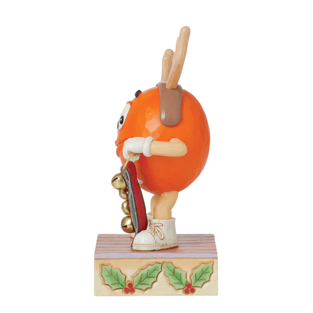 Jim Shore M&M'S: Orange M&M With Strand of Bells Figurine sparkle-castle