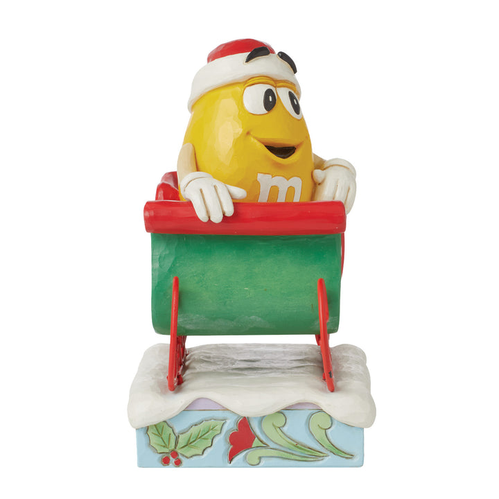 Jim Shore M&M'S: Yellow M&M With Santa Hat and Sleigh Figurine sparkle-castle