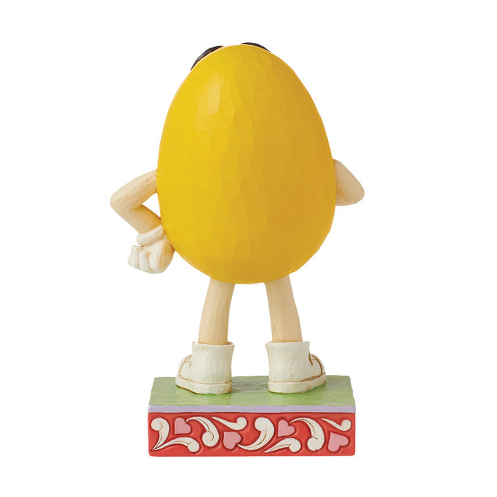 Jim Shore M&M'S: Yellow M&M With Lipstick Kisses Figurine sparkle-castle