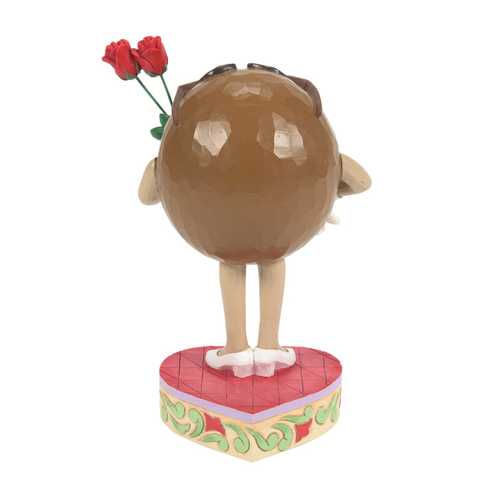 Jim Shore M&M'S: Brown M&M Holding Roses Figurine sparkle-castle