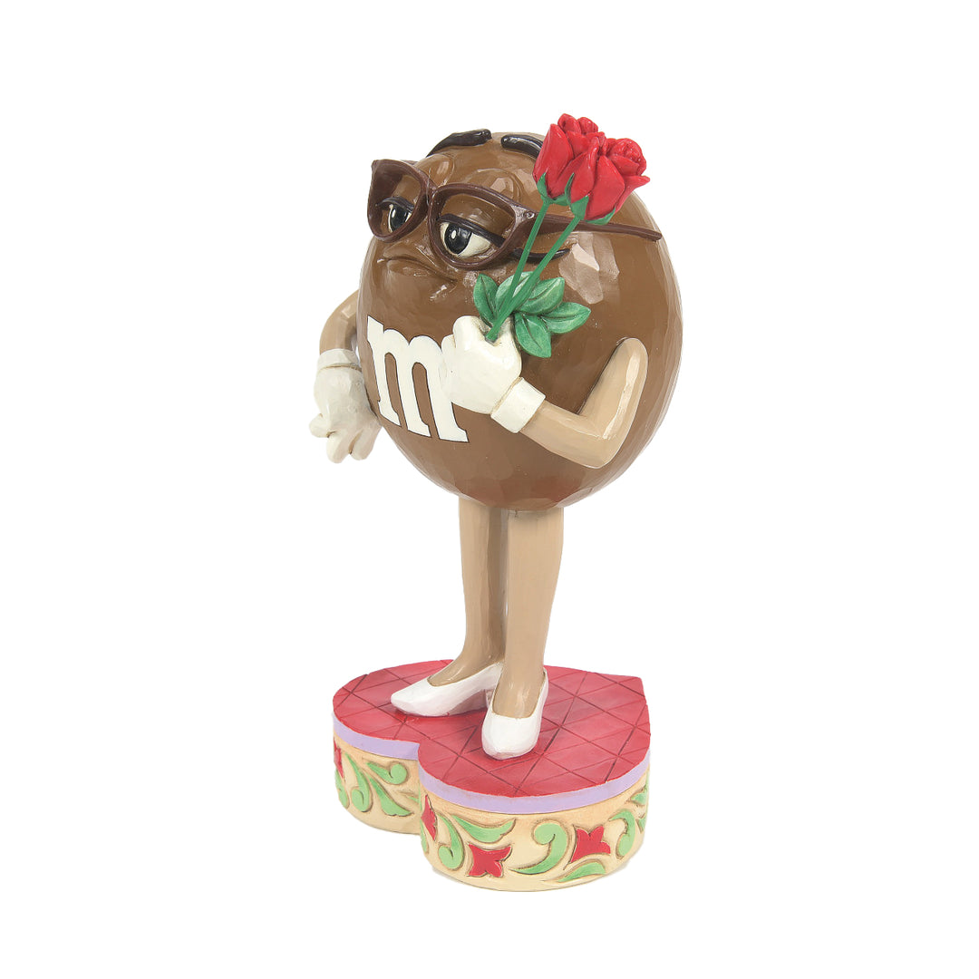 Jim Shore M&M'S: Brown M&M Holding Roses Figurine sparkle-castle