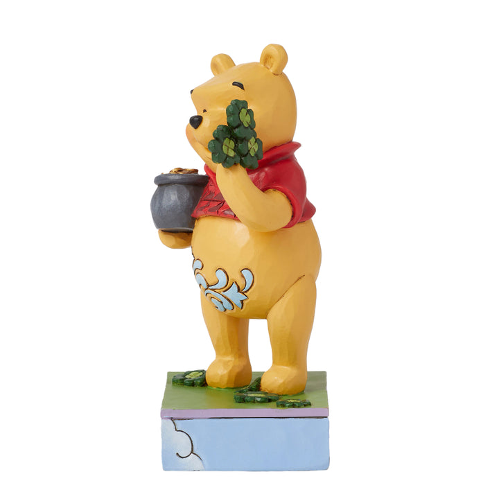 Jim Shore Disney Traditions: Pooh With Clover and Pot of Gold Figurine sparkle-castle