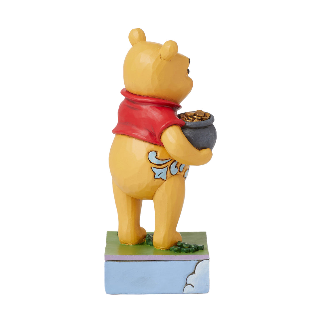 Jim Shore Disney Traditions: Pooh With Clover and Pot of Gold Figurine sparkle-castle