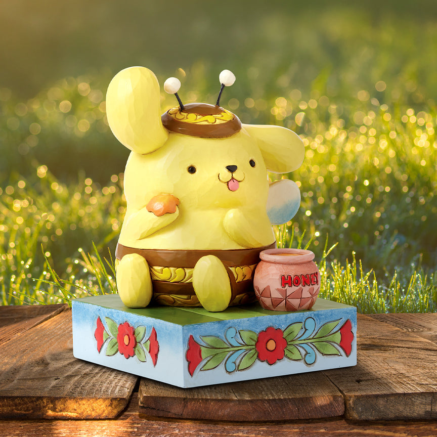 Jim Shore Sanrio: Pompompurin Bumble Bee Figurine sparkle-castle