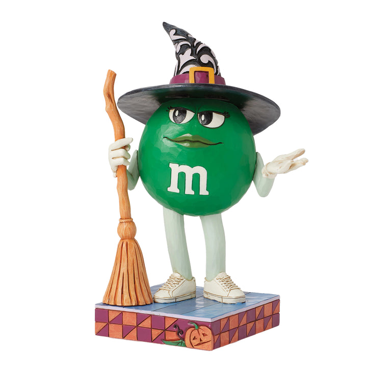 Jim Shore M&M'S: Green M&M Witch With Broom Figurine sparkle-castle