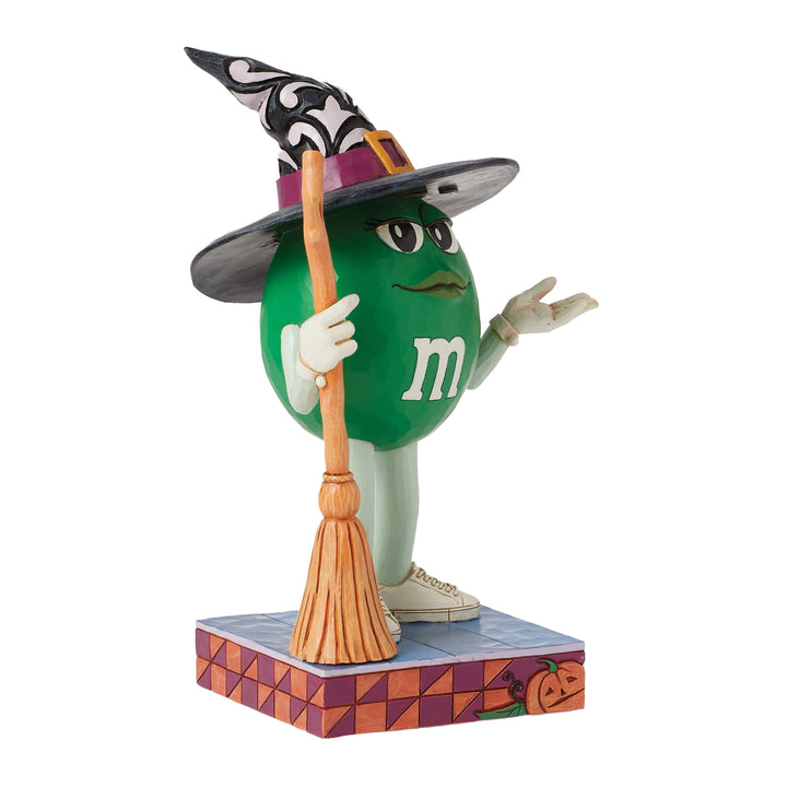 Jim Shore M&M'S: Green M&M Witch With Broom Figurine sparkle-castle