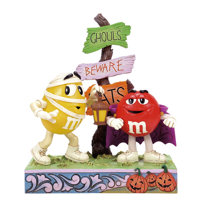 Jim Shore M&M'S: Red M&M Vampire With Yellow M&M Mummy Figurine sparkle-castle