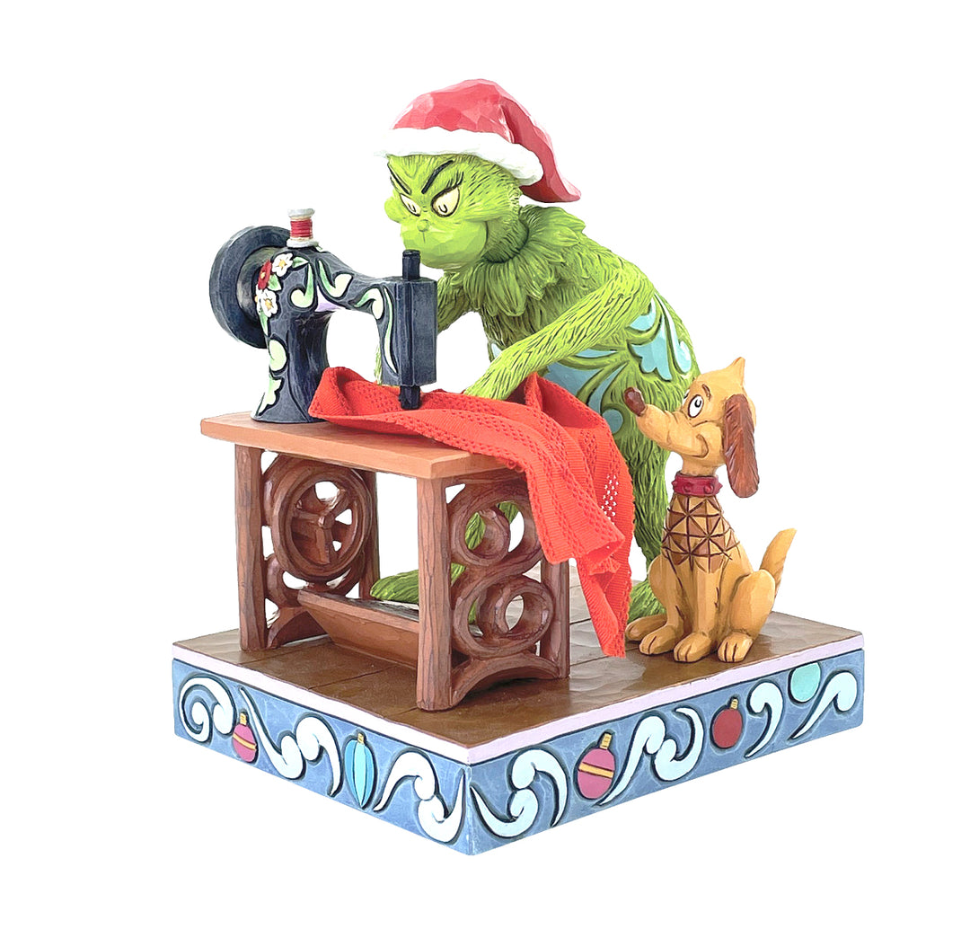 Jim Shore The Grinch: Grinch Sewing Santa Suit Figurine sparkle-castle