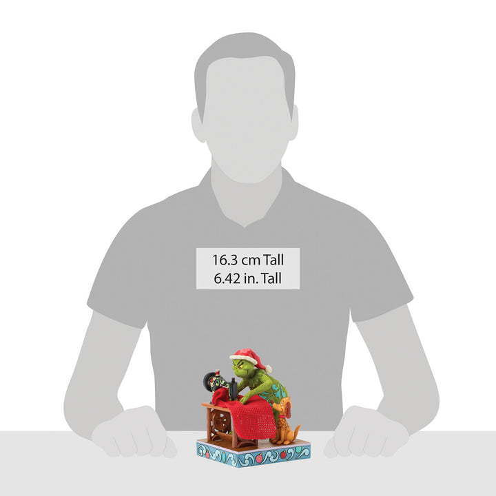 Jim Shore The Grinch: Grinch Sewing Santa Suit Figurine sparkle-castle