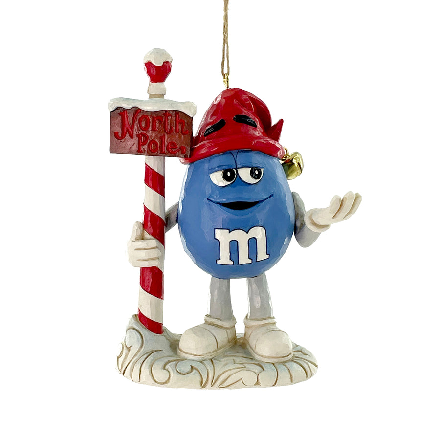 Jim Shore M&M's: Blue M&M With Strand by North Pole Sign Hanging Ornament sparkle-castle