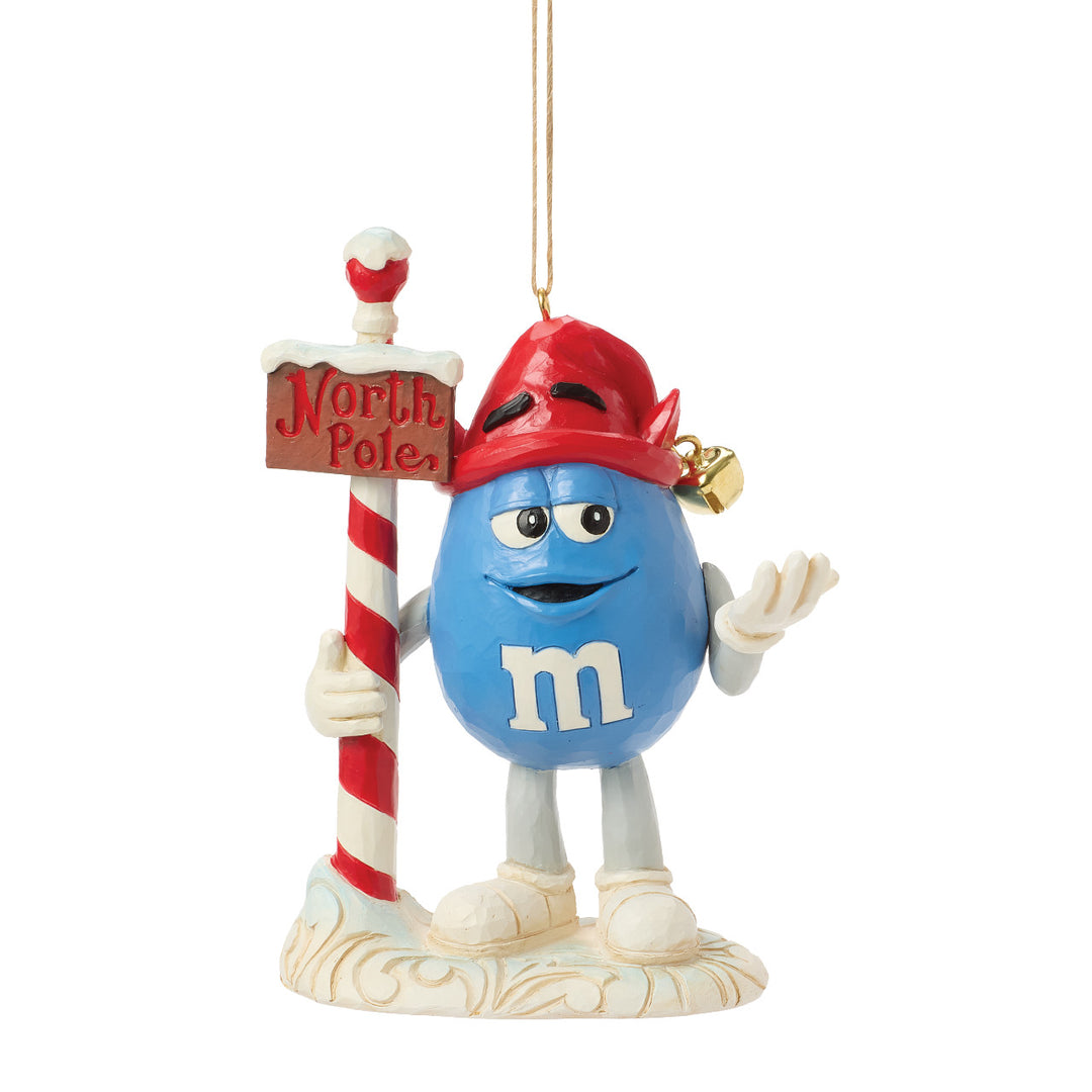 Jim Shore M&M's: Blue M&M With Strand by North Pole Sign Hanging Ornament